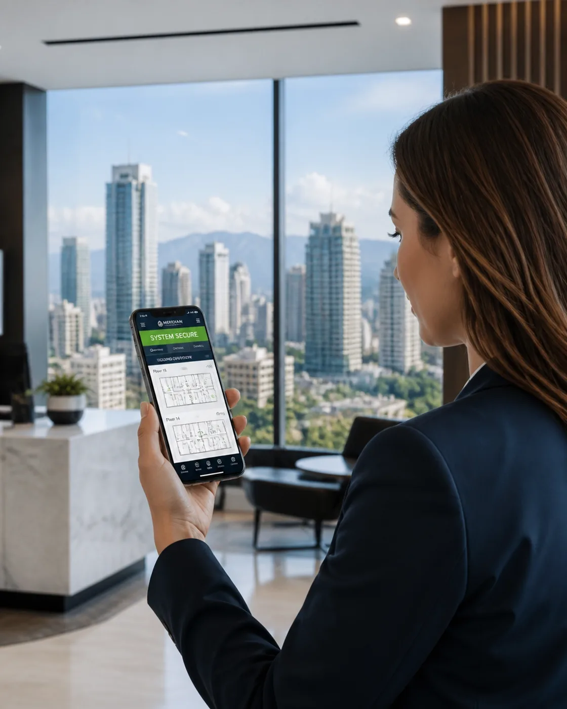 Property manager in a high-rise office viewing a system dashboard on a smartphone
